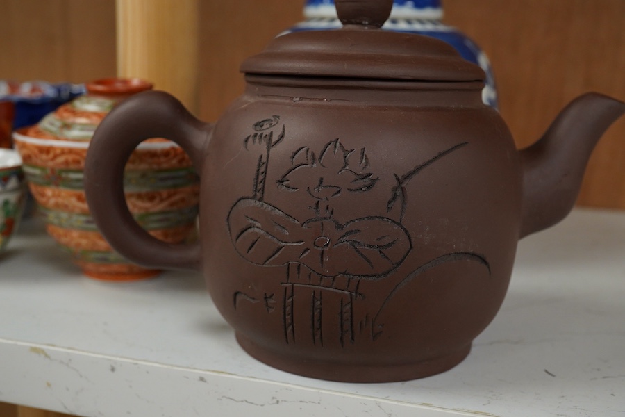 A Chinese Yixing teapot, a blue and white prunus jar, a Kutani tea bowl and two covers, other items, largest 15cm high